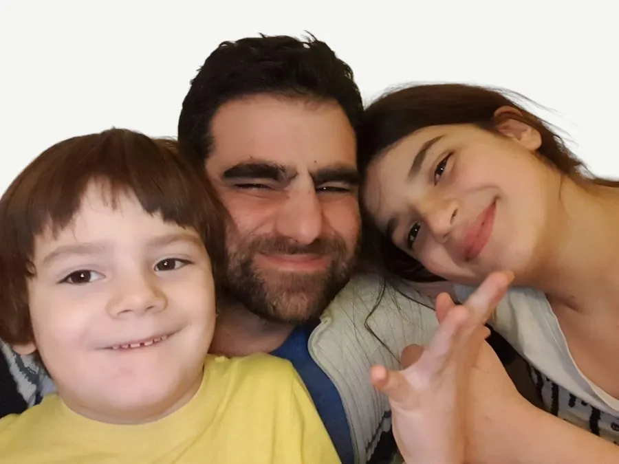 Gaston Sitbon with his two children at home in Wrocław.